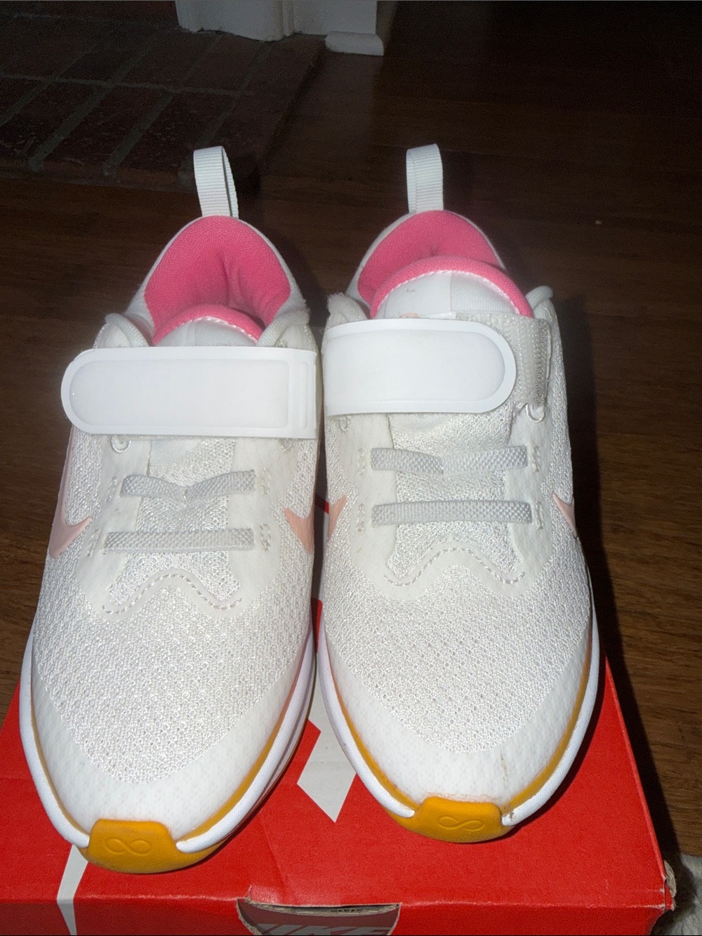 Nike Kids White Sneakers with Pink and Yellow Accents
